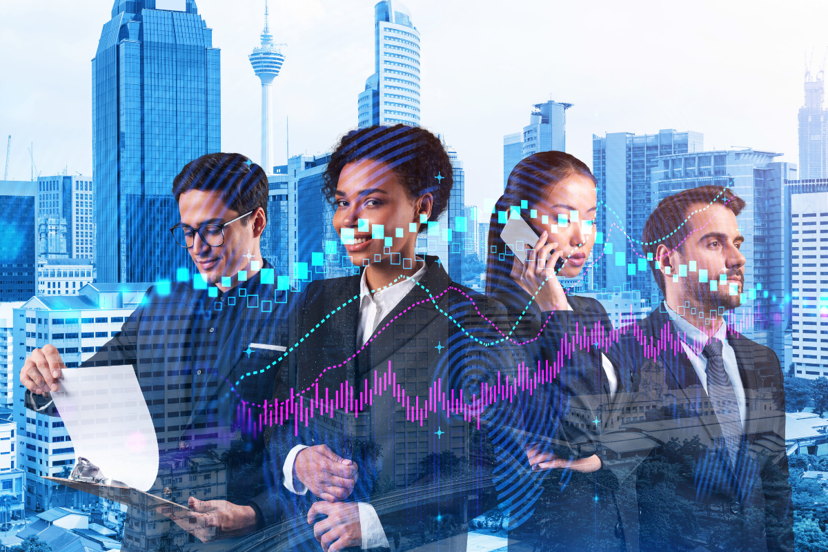 Team of business professionals collaborating against a city skyline